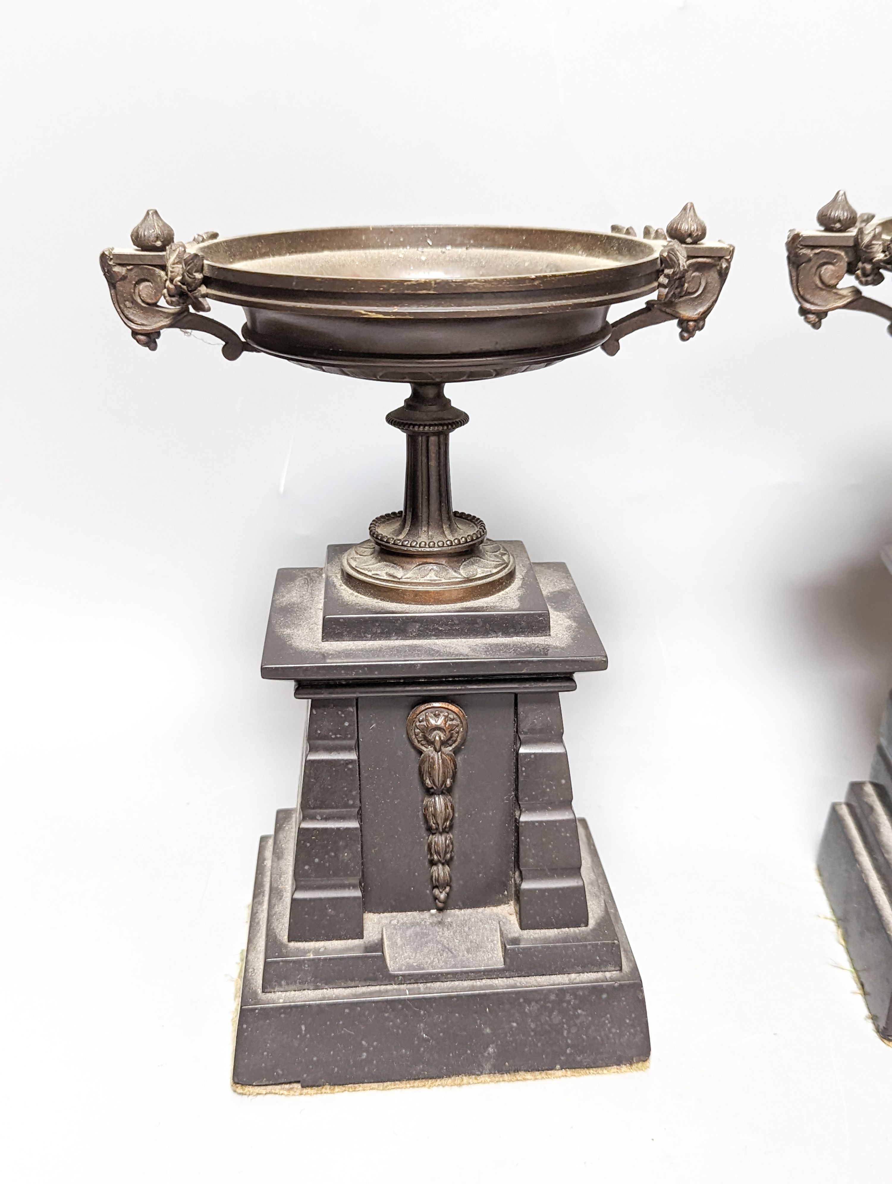 A pair of bronze tazzas on architectural slate bases, c.1900, together with a third, associated piece (3) 25cm
